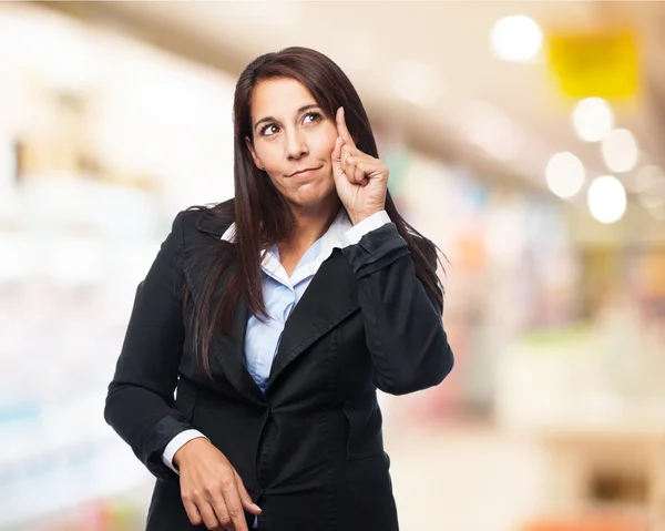 Young business woman pointing — Stock Photo, Image