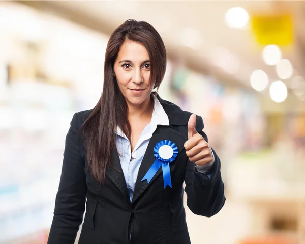 Cool businesswoman with medal — Stock Photo, Image