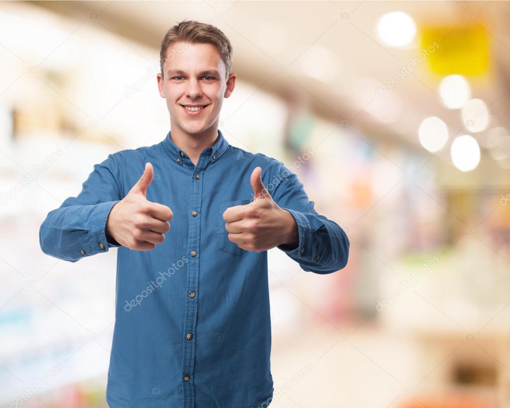 Young man shows okay sign