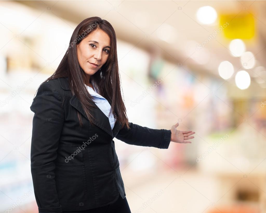 Businesswoman showing welcome sign