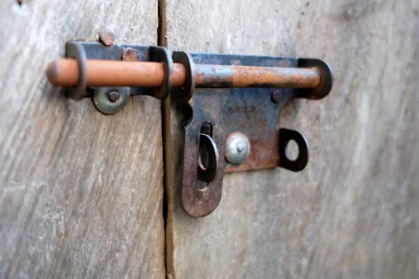 Photo of rusty door latch