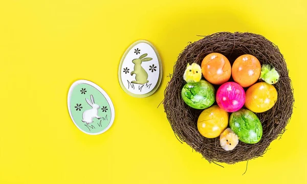 Easter Eggs Nest Wooden Decorative Bunny Yellow Background Holiday Concept — Stock Photo, Image