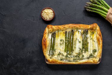 Homemade shortcrust quiche made with green and white asparagus, cream, and parmesan cheese. 