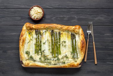 Homemade shortcrust quiche made with green and white asparagus, cream, and parmesan cheese. 