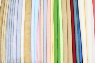 Colored fabric samples.Cloth texture background.Bright collection of colorful textile samples.