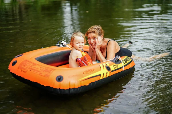 Portrait Happy Grandmother Her Granddaughter Inflatable Boat Lake — Stock Photo, Image
