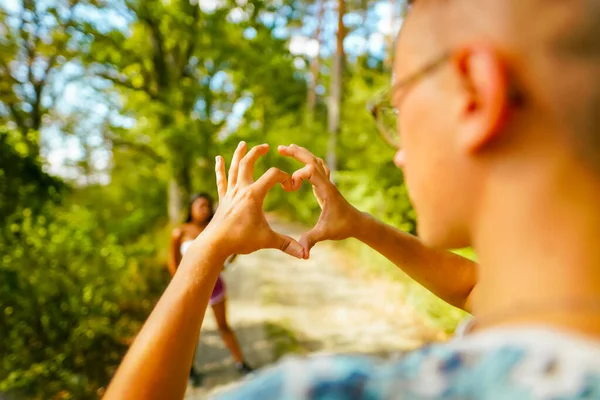 Young Man Doing Heart Sign His Hands Fingers His Girlfriend — Stock Photo, Image