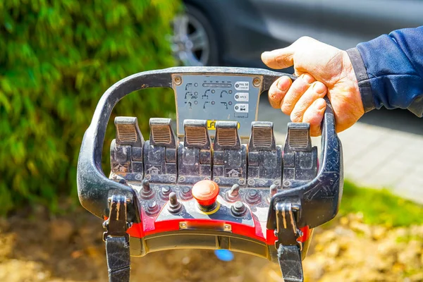 Man Using Mechanism Construction Site Foto Stock