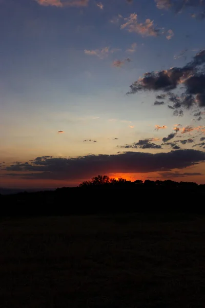 Backlit sunset with yellow, red and blue colors in southern Andalusia, Spain