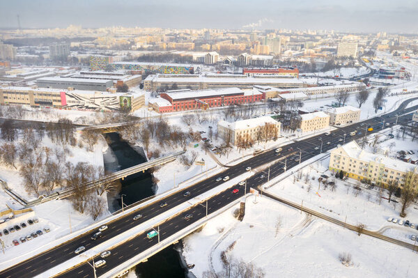 Bridge on the Svisloch River and the road through it with cars in winter.Minsk Belarus.
