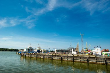 August 16, 2017: Klaipeda, Lithuania.Boats and cranes in the port of Klaipeda.