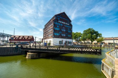 KLAIPEDA, LITHUANIA-AUGUST 16, 2017: Old Mill Hotel on the Dane River embankment in the old town of Klaipeda, Lithuania.