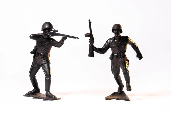 Vintage toy black soldiers isolated on white background.