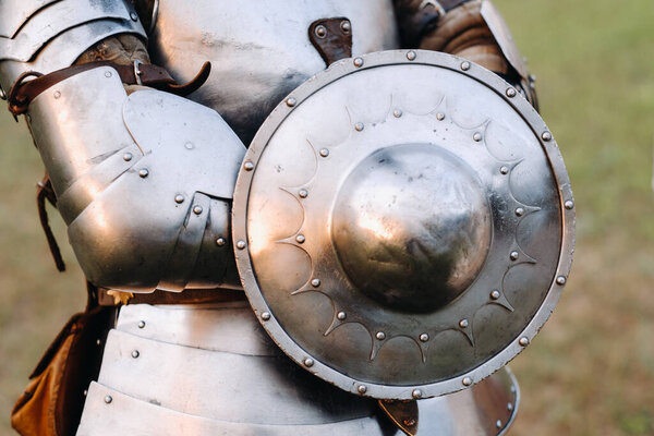 An ancient shield of ancient knight's armor.A medieval concept.Metallic texture.