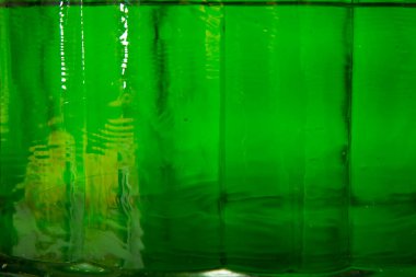 Yeşil arka plan. Gıda sıvıları için Clos-up yeşil konteyner.