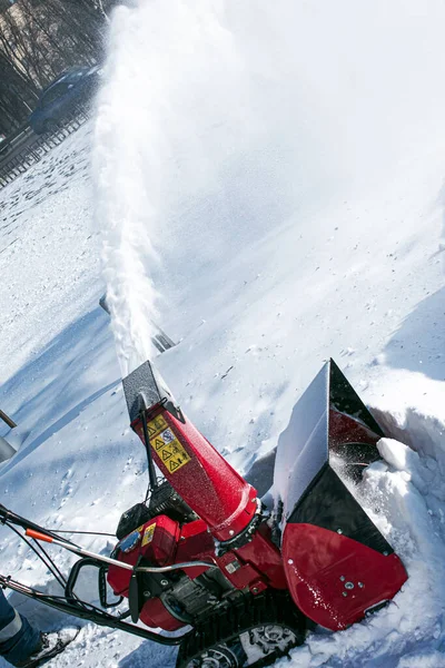 Tracked snow blower at work. After heavy snowfalls, snow is removed everywhere.