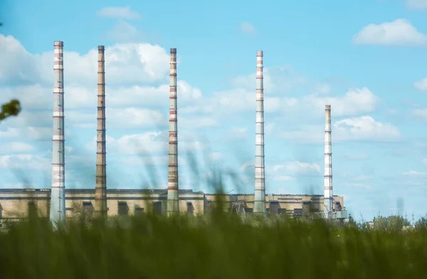 Coal power plant. Thermal energy concept. Chimneys against the blue sky.