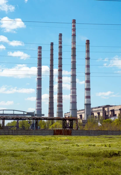 Coal power plant. Thermal energy concept. Chimneys against the blue sky.