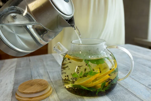 Woman Pours Hot Water Kettle Mint Tea Sliced Lemon Process — Stock Photo, Image