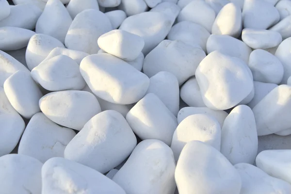 Primer plano de piedras blancas, guijarros en Santorini — Foto de Stock