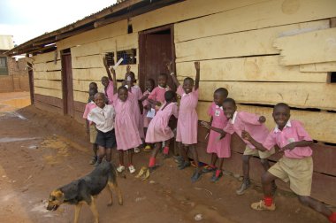 Children in pink school uniform at their school, Uganda clipart