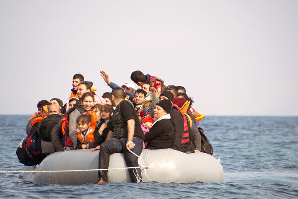 Refugees arriving in Greece in dinghy boat from Turkey. 