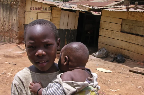 Young boy is carying his little brother — Stock Photo, Image