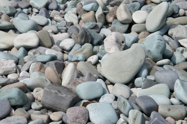 Blauwe steentjes op Pengajawa strand Flores, Indonesië — Stockfoto