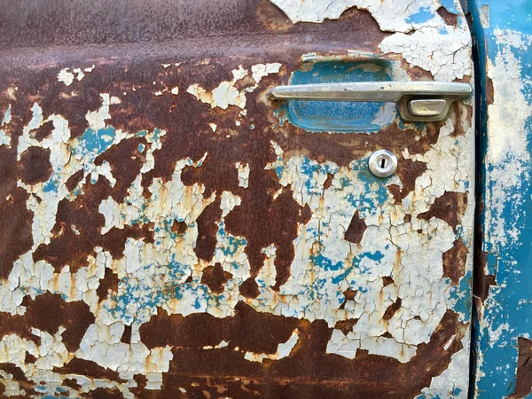 Peeling paint old car door and rusty texture