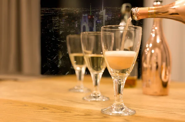 Champagne pouring in  to glasses — Stock Photo, Image