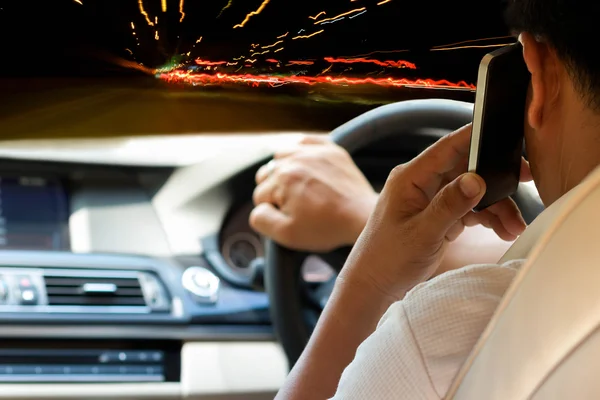 Concept Man Driving and using cell phone at night — Stock Photo, Image