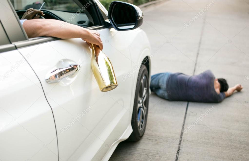 drinking-alcohol-while-driving-is-dangerous-stock-photo-by-bignai