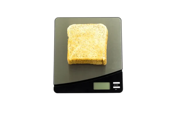 Cuidados de saúde conceptuais pesando pão em uma escala isolada — Fotografia de Stock