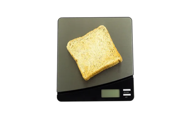 Conceptuele gezondheidszorg brood met een gewicht op een schaal die geïsoleerd — Stockfoto