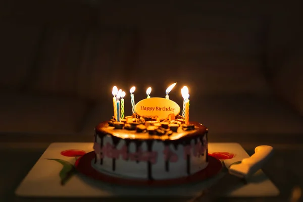 Birthday Cake Black Background Colorful Candles Lit — Stock Photo, Image