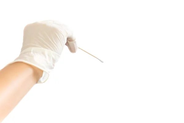 Hand with glove holding cotton stick for swab test isolated in white background. — Stock Photo, Image