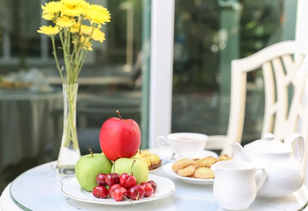 Tea time with chocolate and cookies or biscuit and fruit — Stock Photo, Image