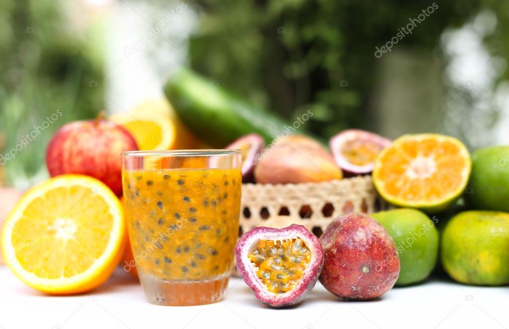 Selected Focus glass of fresh passionfruits and vegetables 