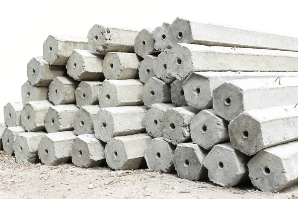 A pilha de pilhas fundação de concreto hexágono isolado — Fotografia de Stock