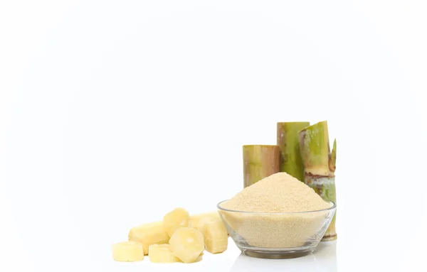 Brown Sugar in bowl and stump of sugar cane — Stock Photo, Image