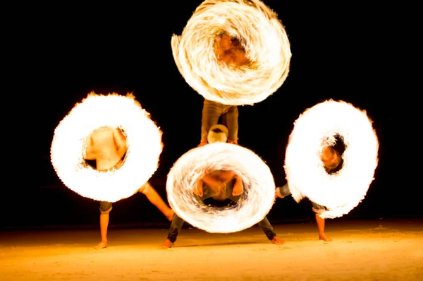 Group of people doing Fire show on beach party — Stock Photo, Image