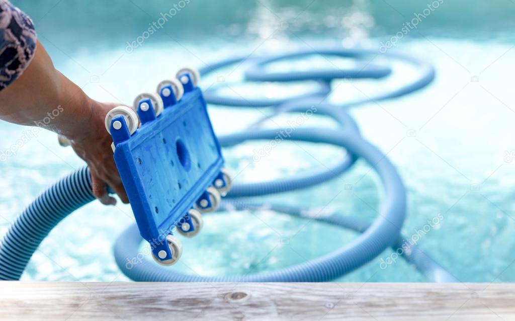 Focus on front roller of  equipment cleaning swimming pool