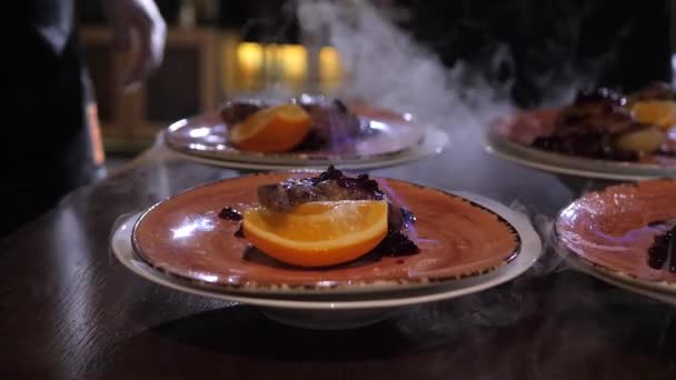 Chef pours absinthe on the roasted duck and sets the dish on fire — Stock Video