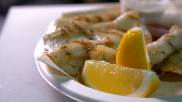 Grilled Colmar with lemon and various mousses on white plate. — Stock Video