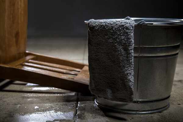 Torture chamber with a water bucket