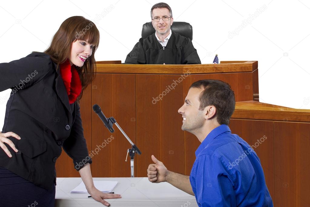 Defendant with lawyer in courtroom