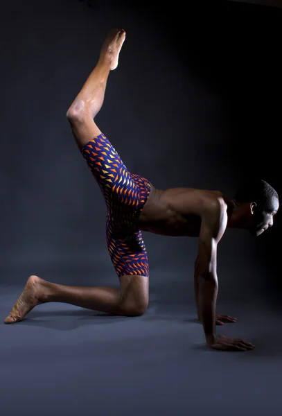 Man doing yoga stretches — Stock Photo, Image
