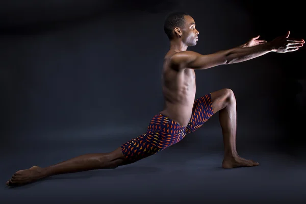 Man doing yoga stretches — Stock Photo, Image