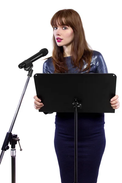 Girl speaking into a microphone — Stock Photo, Image