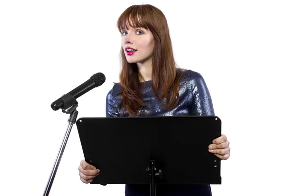 Girl speaking into a microphone — Stock Photo, Image